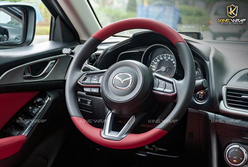 Khâu bọc da vô lăng ô tô Mazda 3